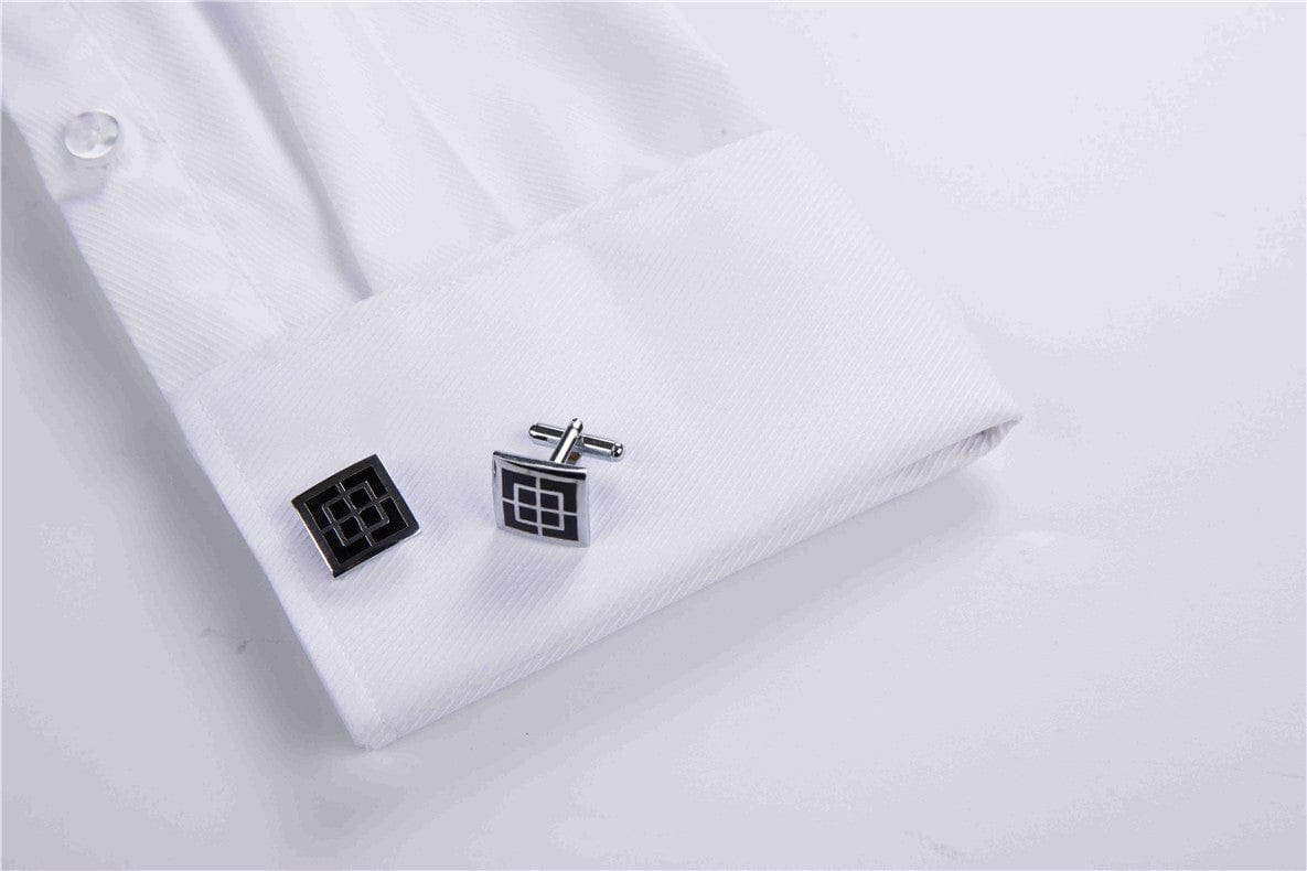 Close-up of a white dress shirt sleeve with silver and black square cufflinks, featuring a modern geometric design. The formal cufflinks add a stylish touch, perfect for business, weddings, and special occasions.