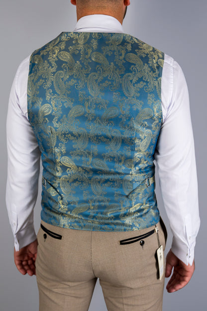 A rear view of the Suitbae Charles beige suit waistcoat, showcasing a luxurious teal paisley-patterned satin back. The design features adjustable side straps for a customised fit, paired with beige Prince of Wales check trousers. The contrast between the intricate paisley and the classic check pattern adds a refined touch to this formal ensemble. Perfect for weddings, business, or special events.