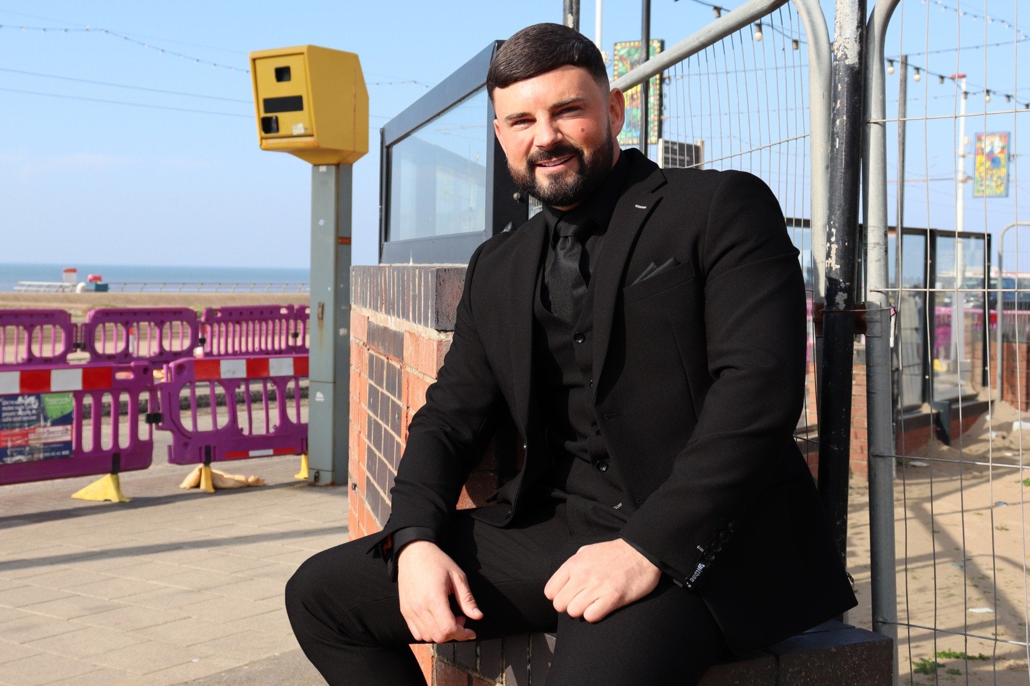 Groom wearing the SUITBAE Diablo Black Three-Piece Suit for a modern UK formal night in 2026.
