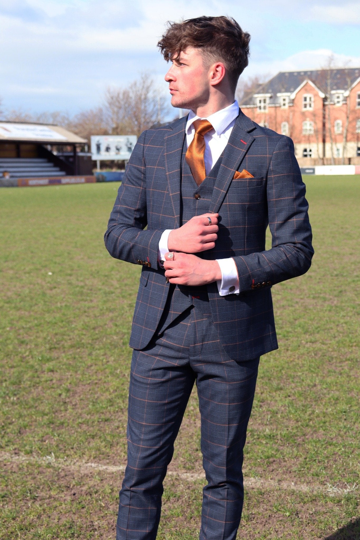 Man wearing the Thomas Check Three-Piece Suit — navy textured fabric, tailored fit for autumn weddings and race days.