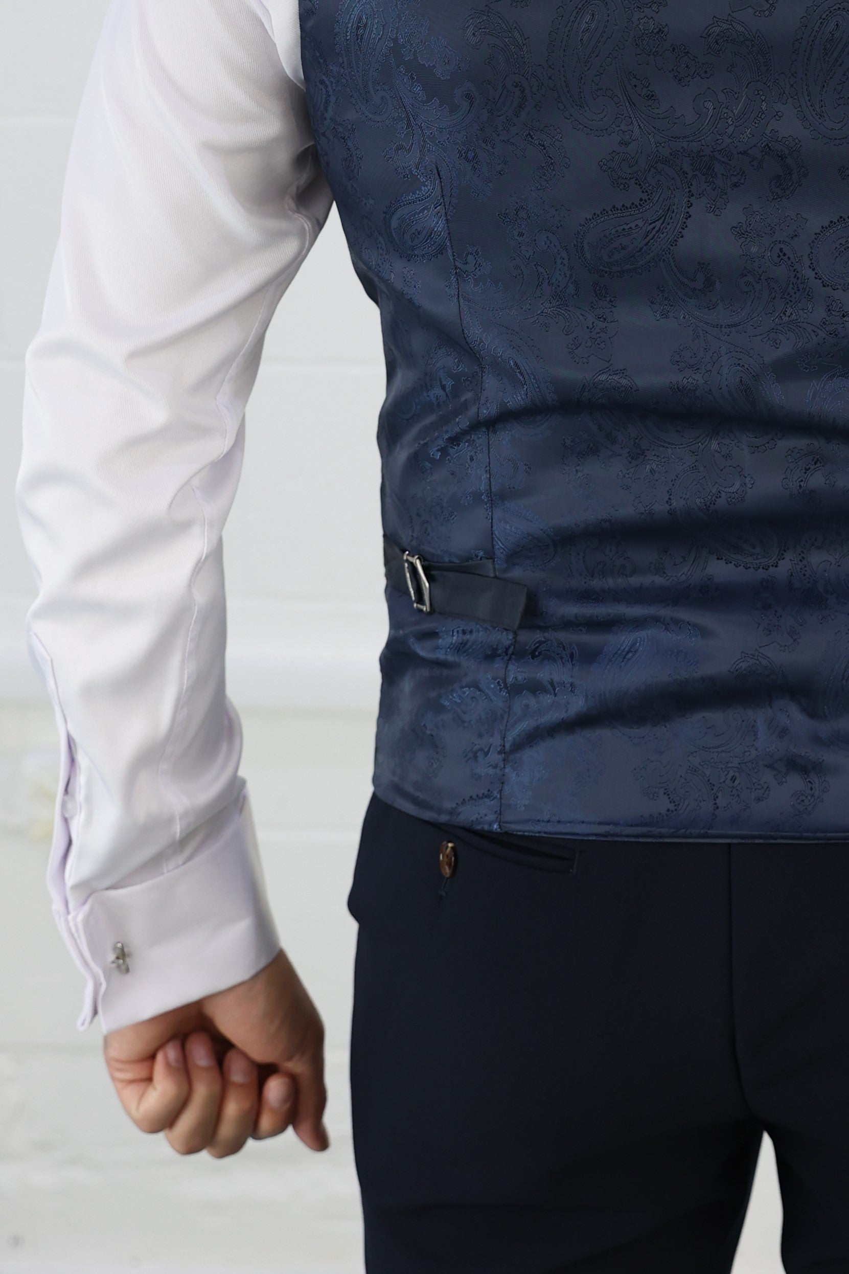 Back view of a navy waistcoat with an intricate paisley silk pattern, adjustable strap, and matching trousers. Tailored for XL, Plus Size, and Big & Tall men's sizes. Available at Suitbae.com