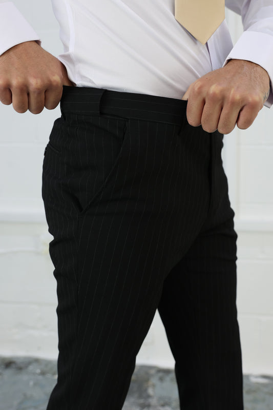 Close-up of Suitbae black pinstripe slim tailored fit tapered trousers, featuring an elastic waistband for added comfort and flexibility; designed to be sold individually for formal or smart-casual occasions.