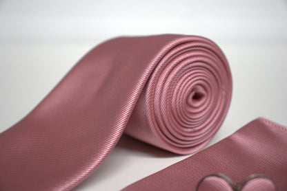 Detailed view of mauve pink satin tie with rolled fabric, elegant men’s wedding and prom accessory