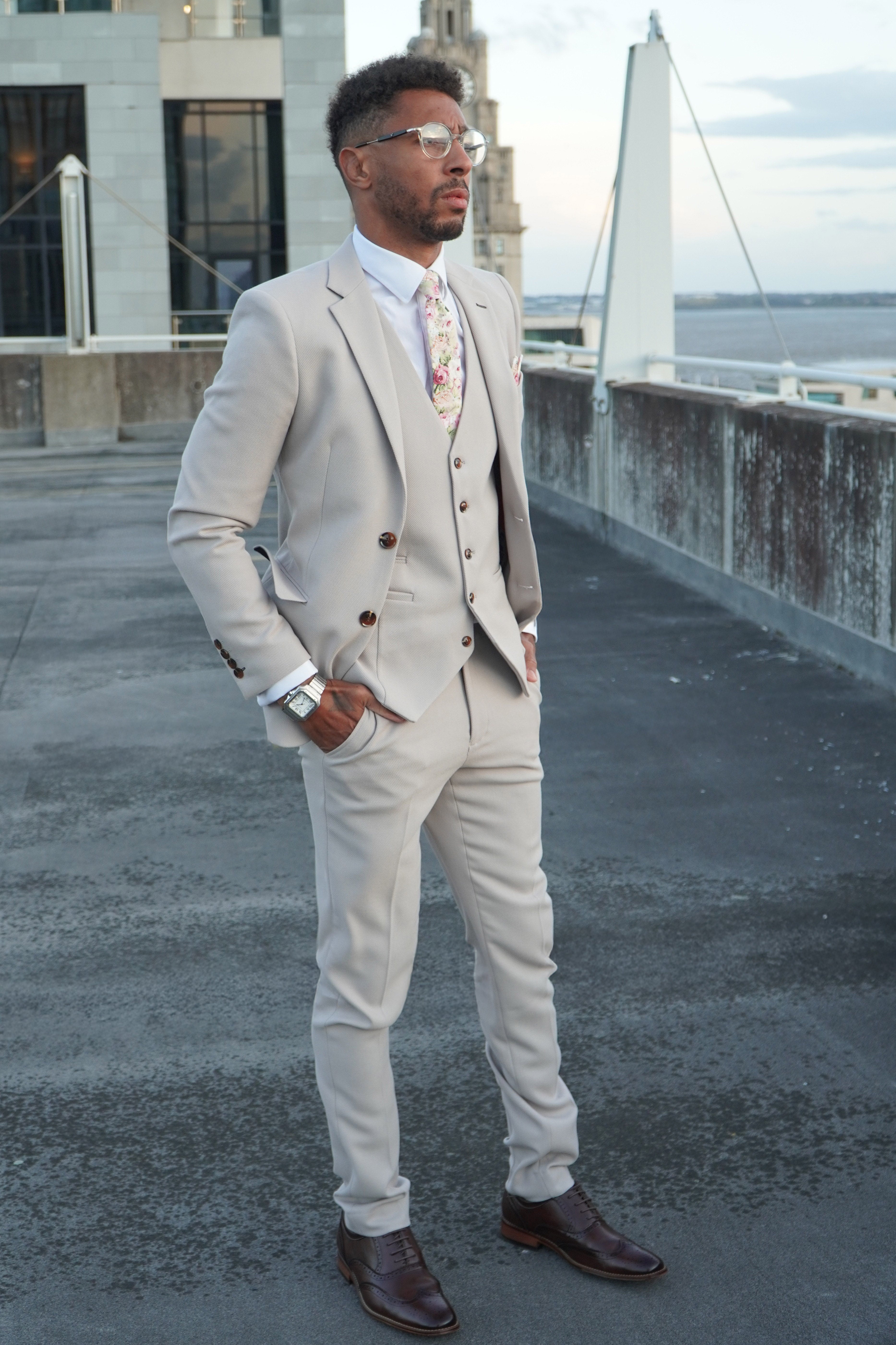 Escobar Stone three-piece suit worn open for summer weddings