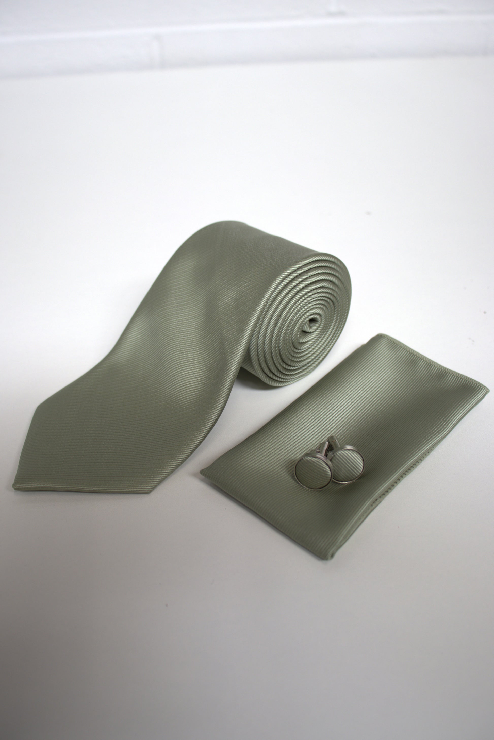 Sage green tie set with matching pocket square and cufflinks for weddings, proms, and formal occasions.