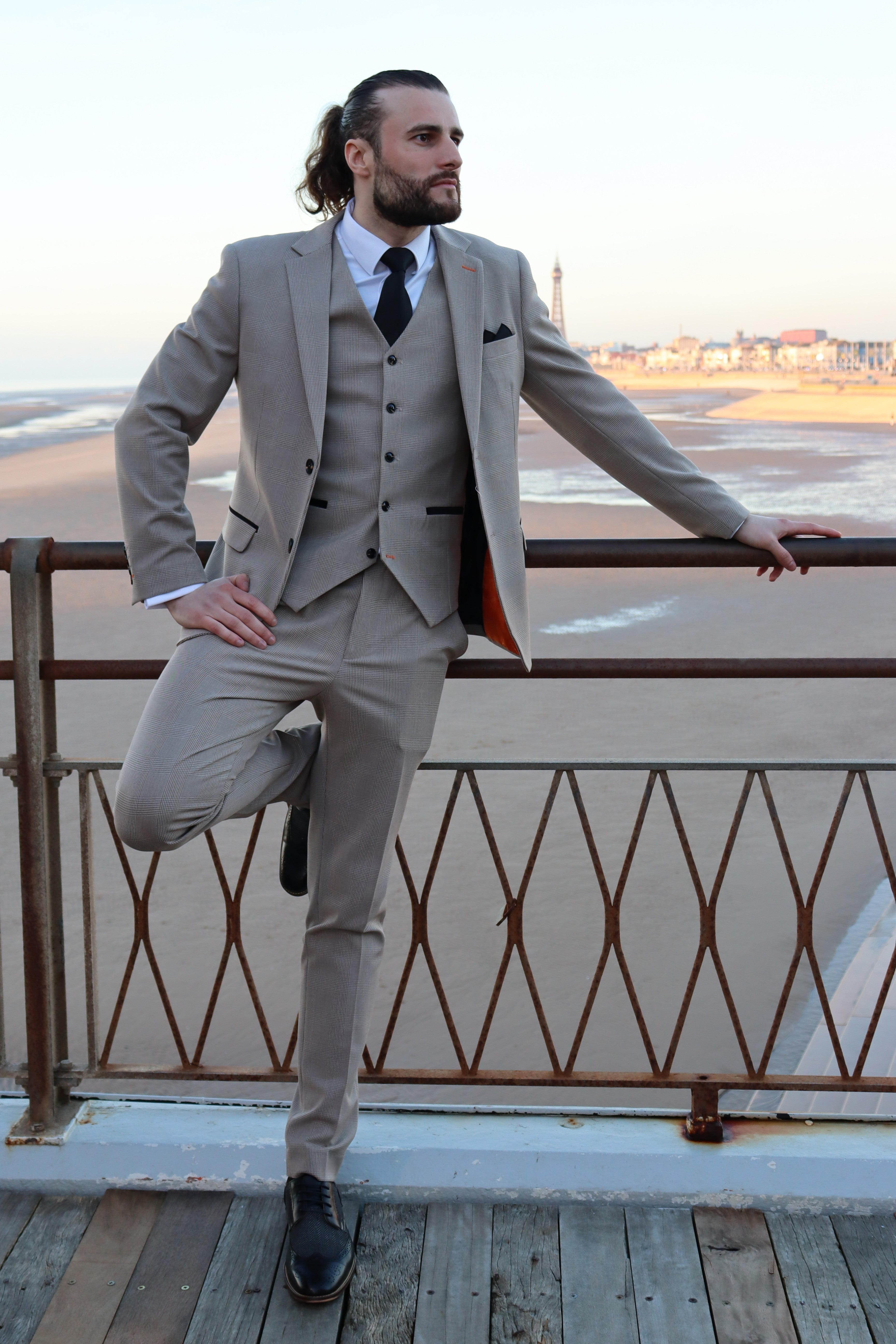 Model wearing the SUITBAE Charles Beige Three-Piece Suit — light beige colour, perfect for spring weddings and events.