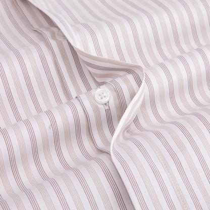 close-up of the beige round collar doublecuff shirt showing off its hidden buttons feature