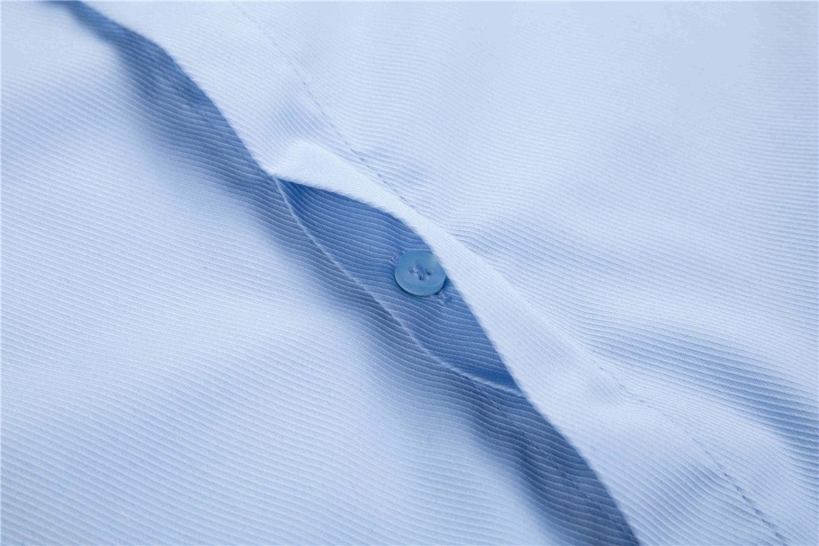 close up of hidden button feature of blue doublecuff shirt